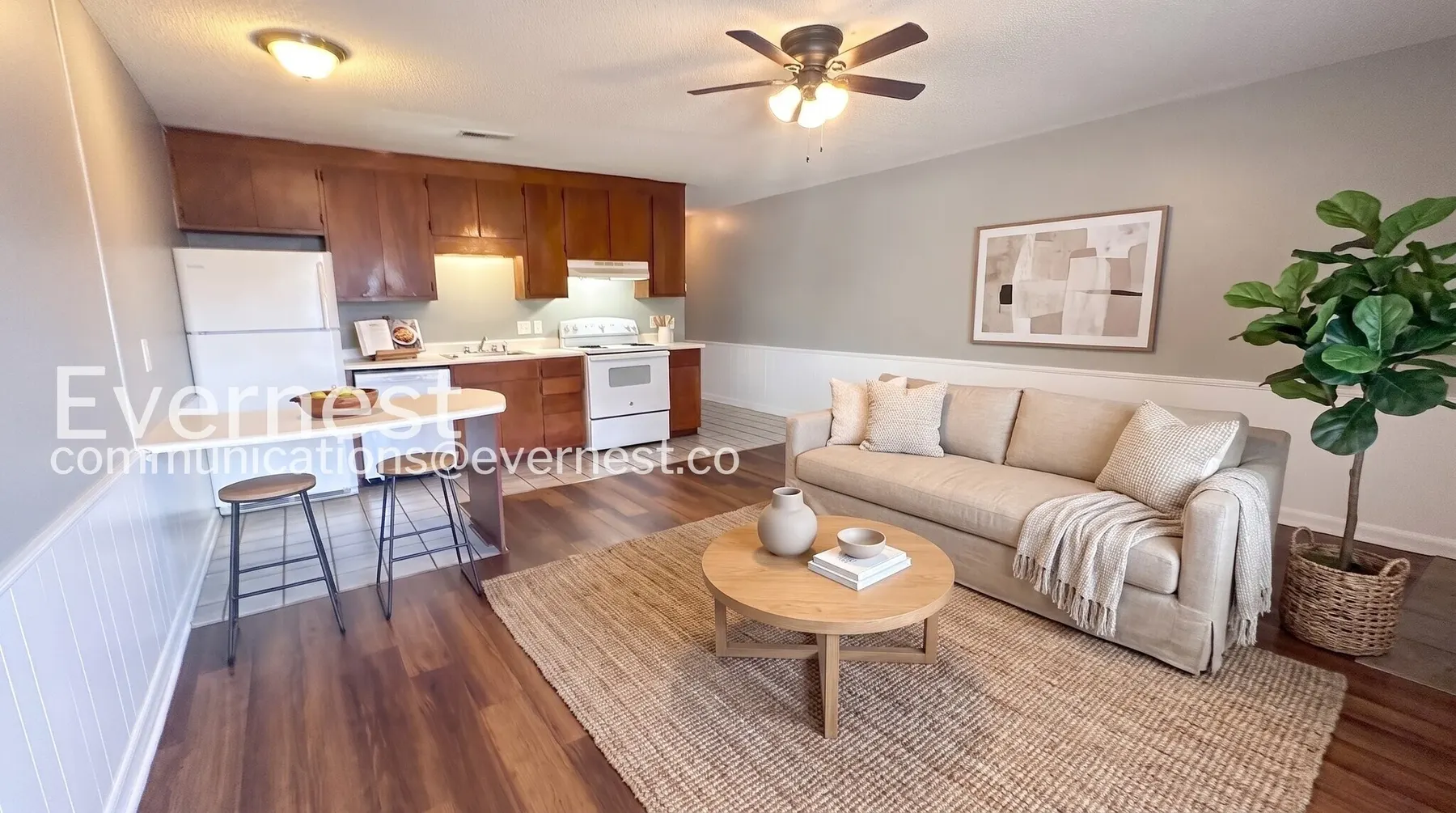 Virtually staged living room and kitchen at Midtown Manor Apartments in Huntsville